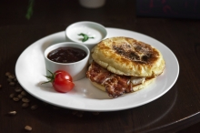 Omelet with bacon in English Muffin